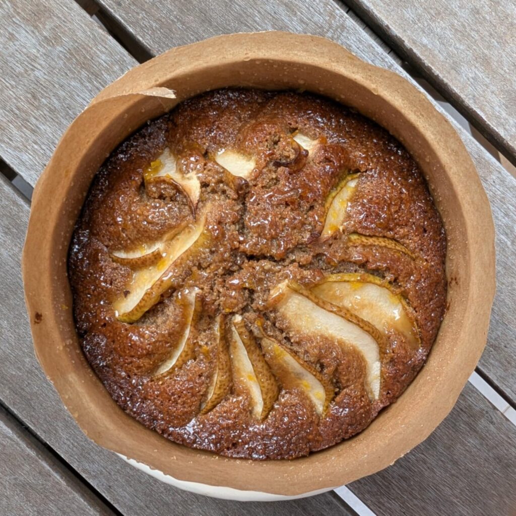 photo of a brown cake on a wooden table