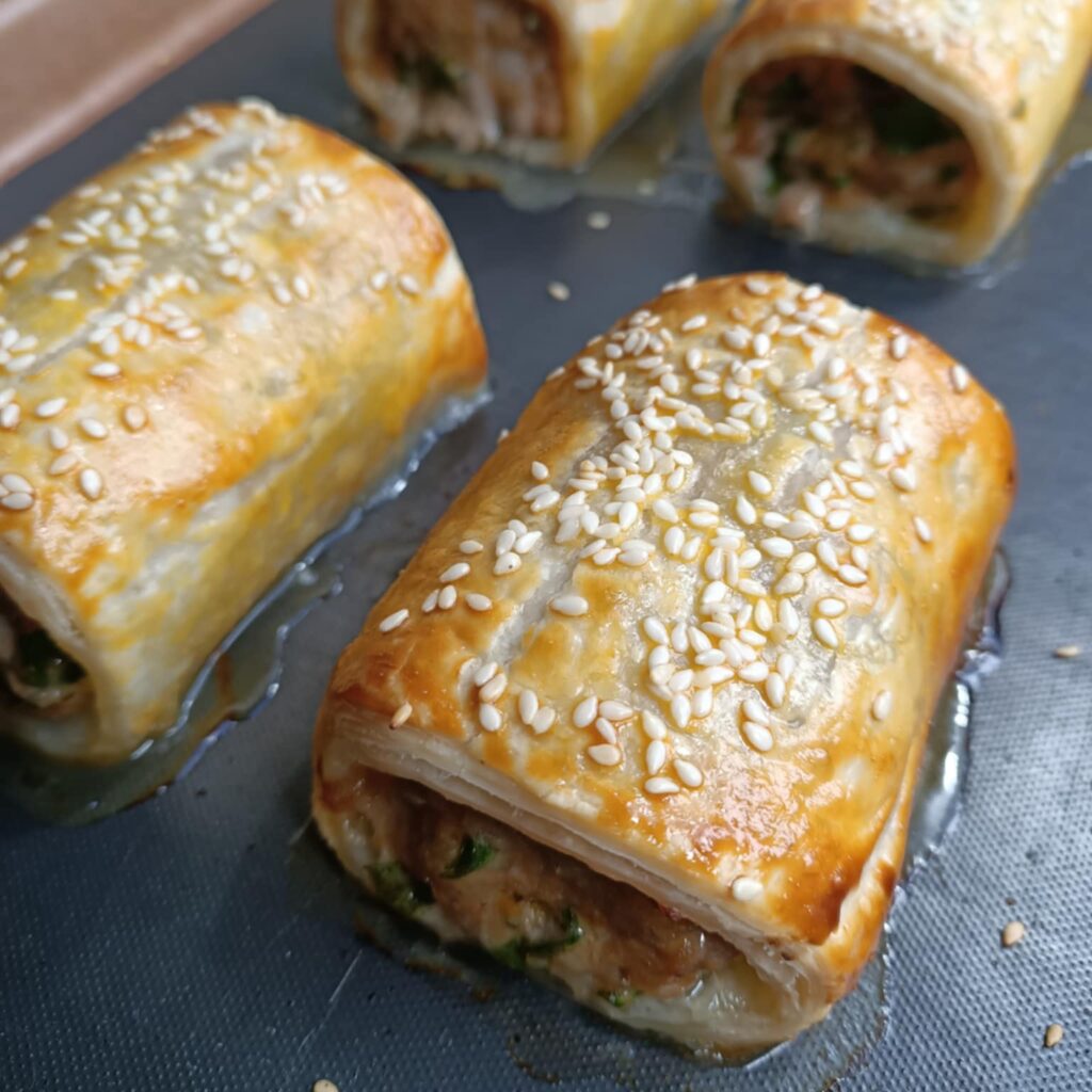 photo of pastry rolls with sesame seeds on top