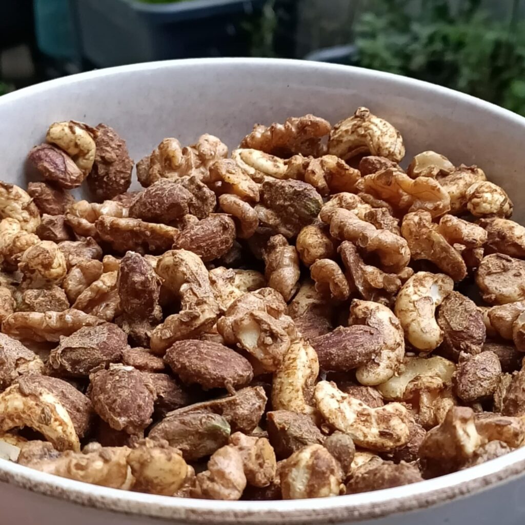 photo of a beige bowl full of nuts