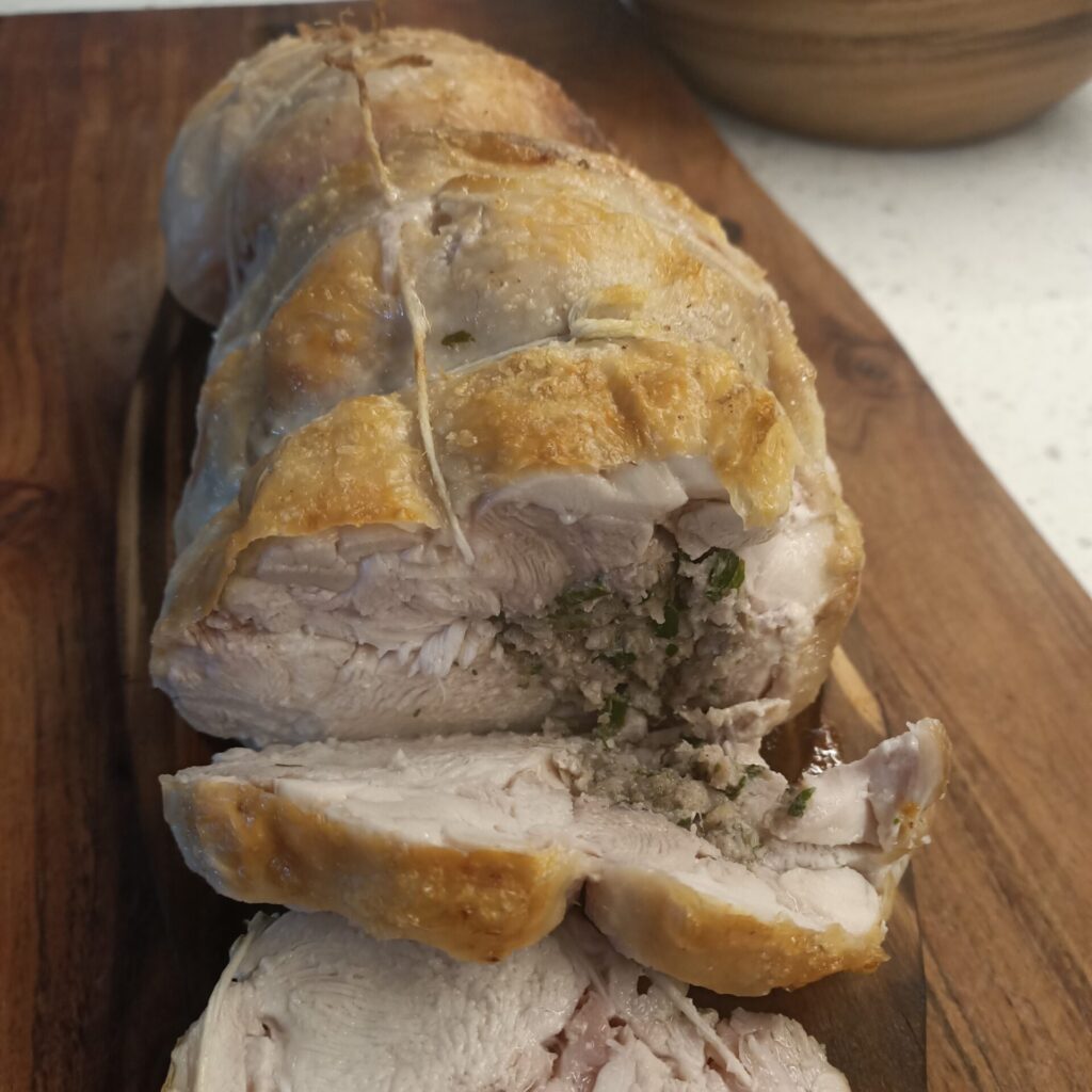 photo of a sliced roast chicken roll