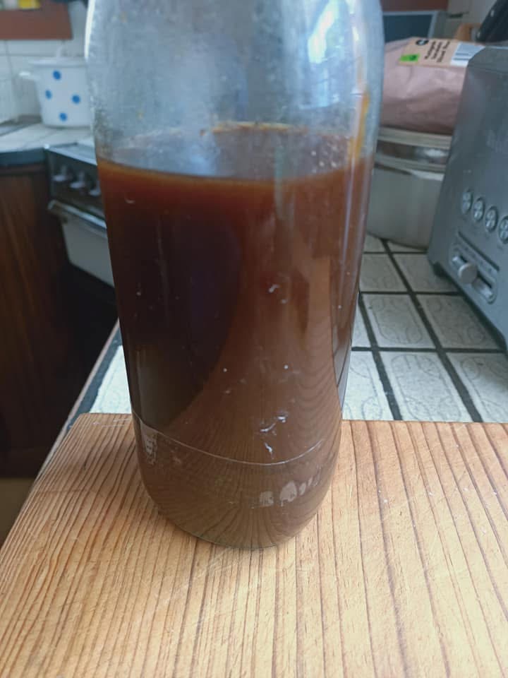photo of a dark brown liquid in a jar