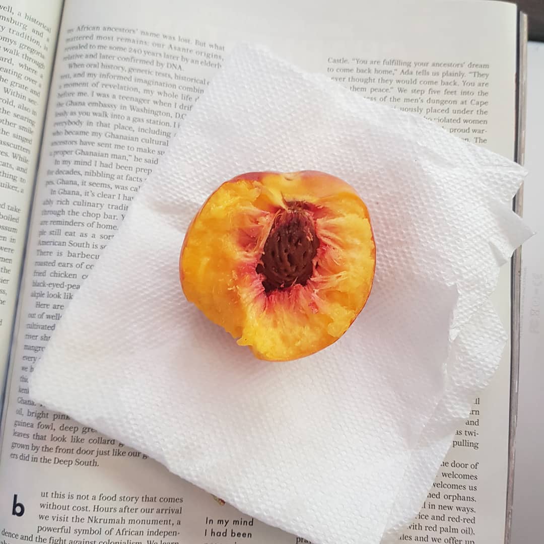 photo of a half eaten peach