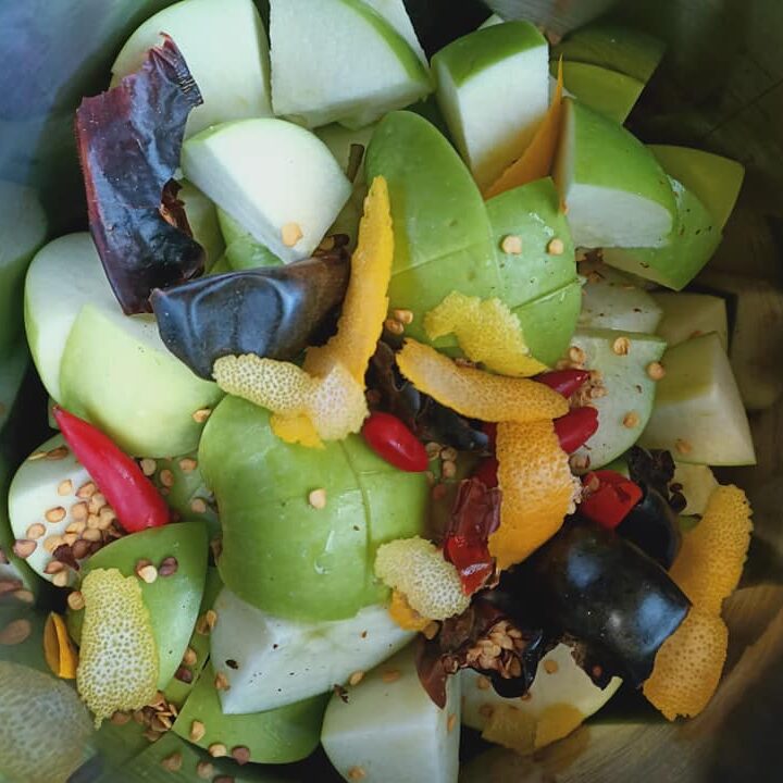 photo of chopped up apples, lemon and dried chillies
