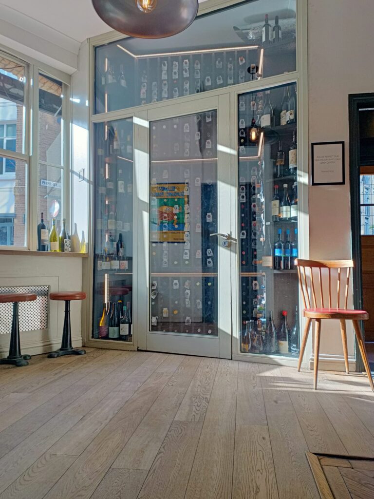 photo of am empty restaurant interior with sun streaming in window