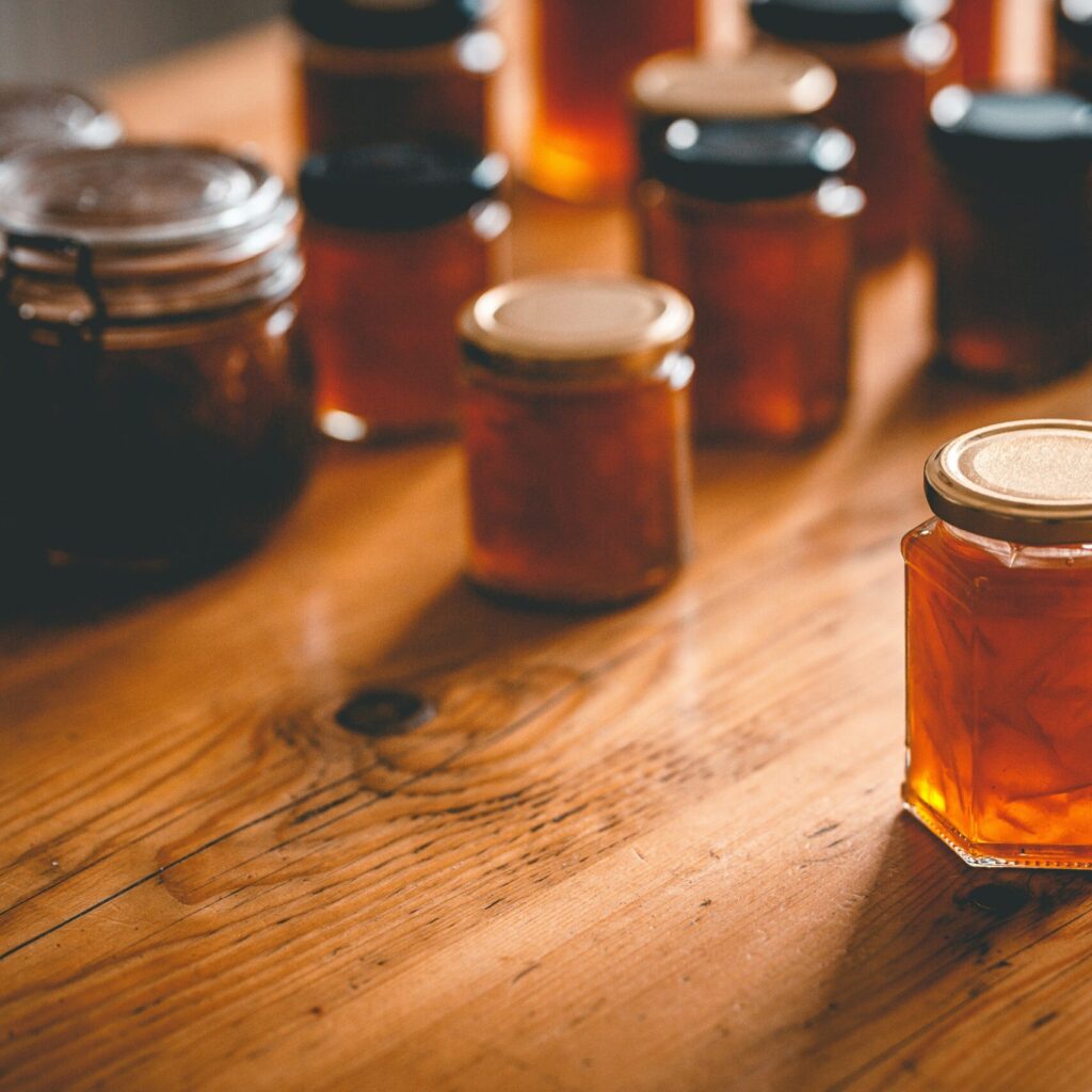 photo of glass jars on a wooden table