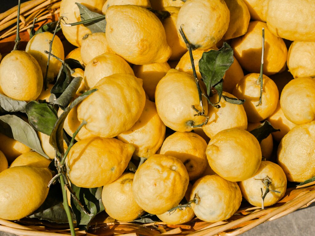photo of a basket of yellow lemons