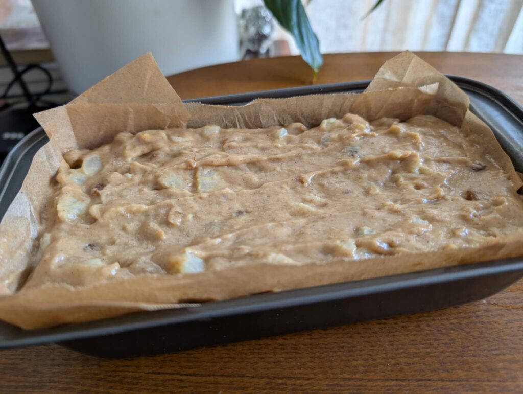 photo of uncooked cake batter in a loaf tin