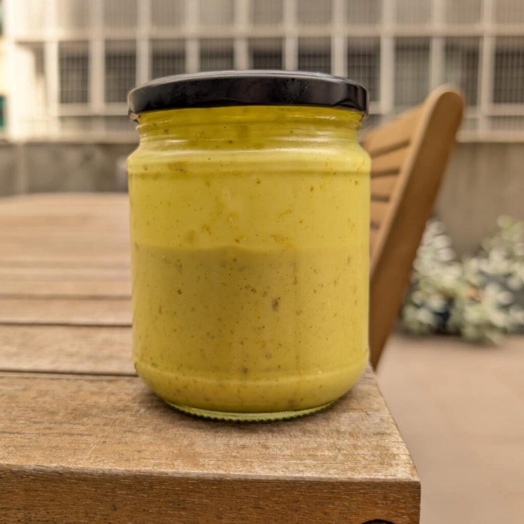 photo of a bright yellow liquid in a glass jar