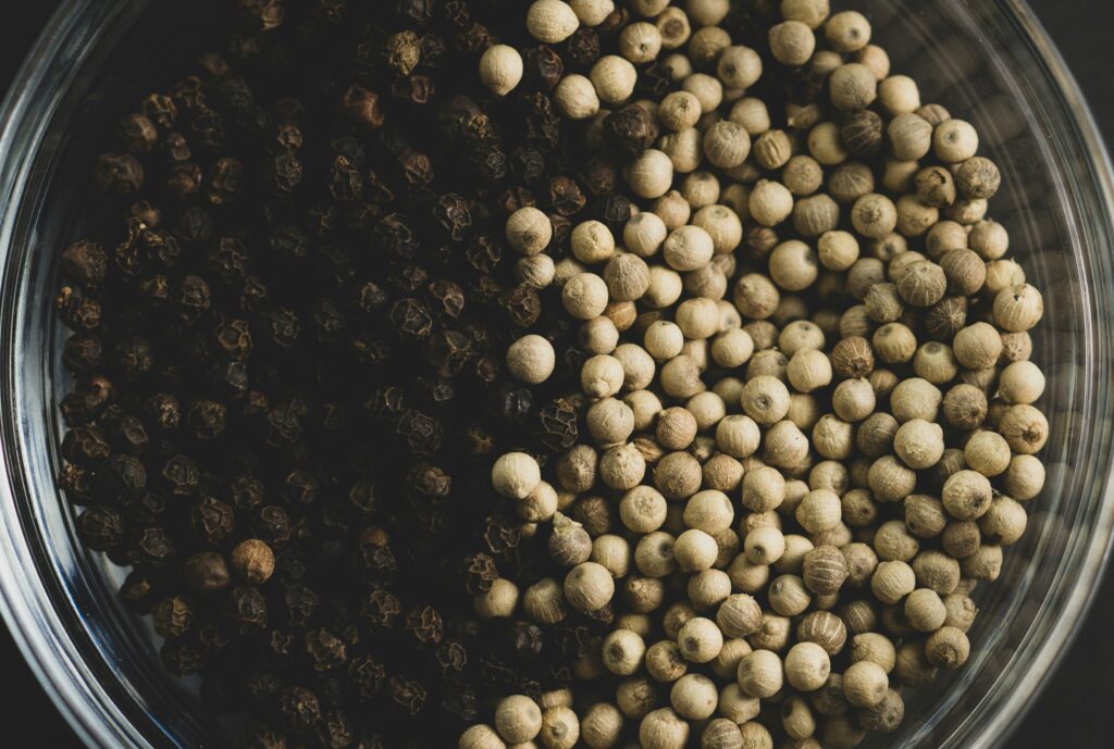 black and white whole peppercorns
