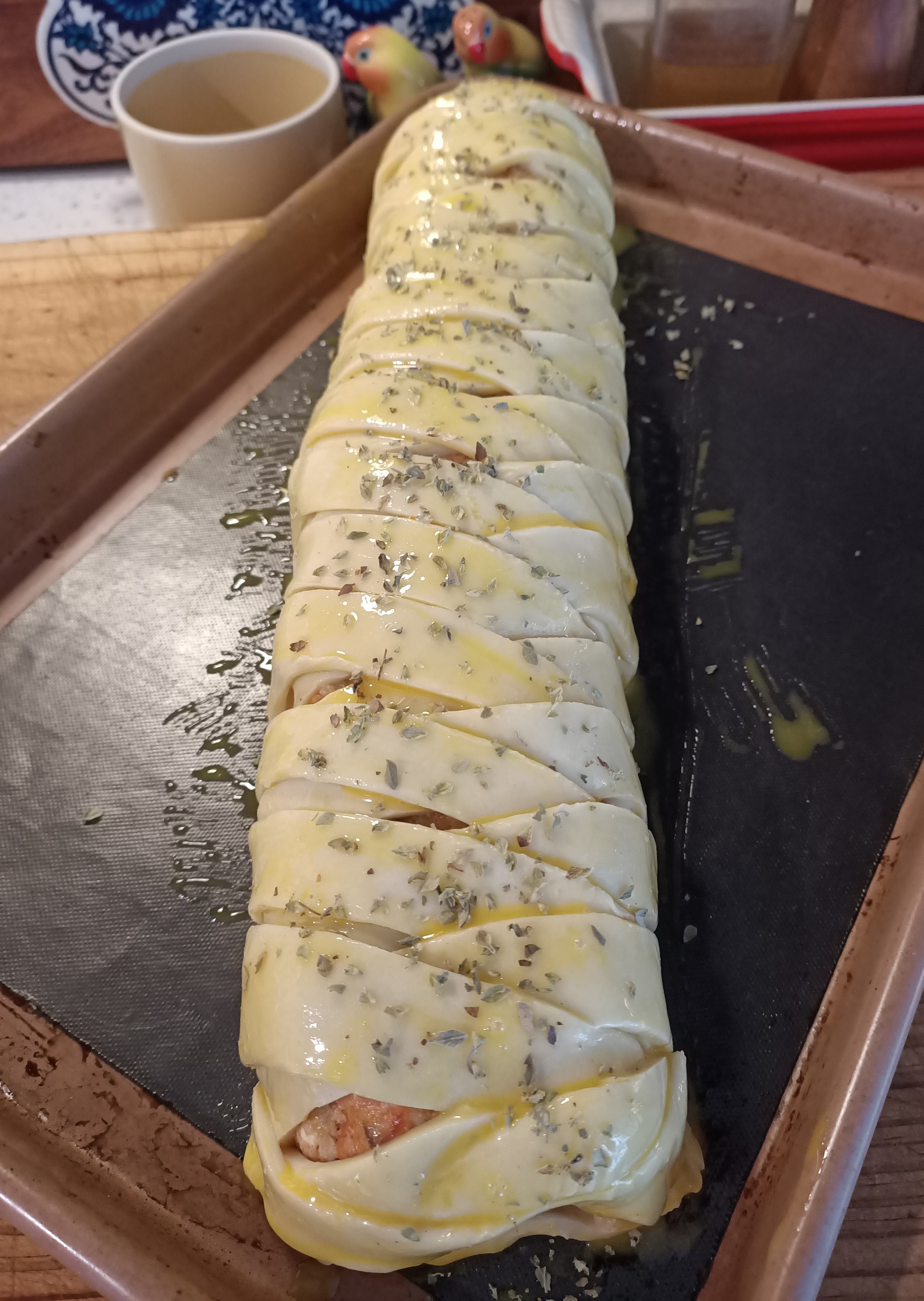 photo of a pastry braid plait on a sausage roll