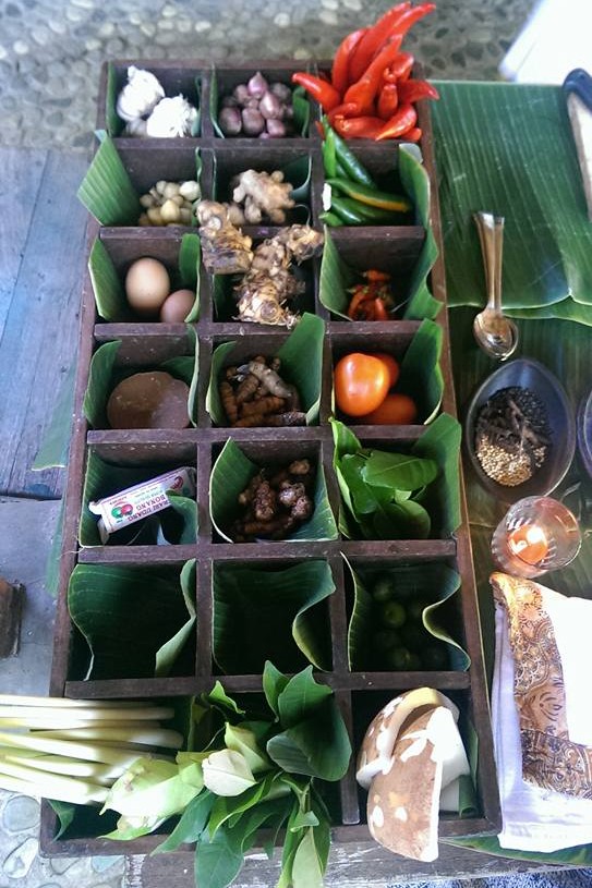 photo of a set of wooden boxes with pices and herbs lined up in squares