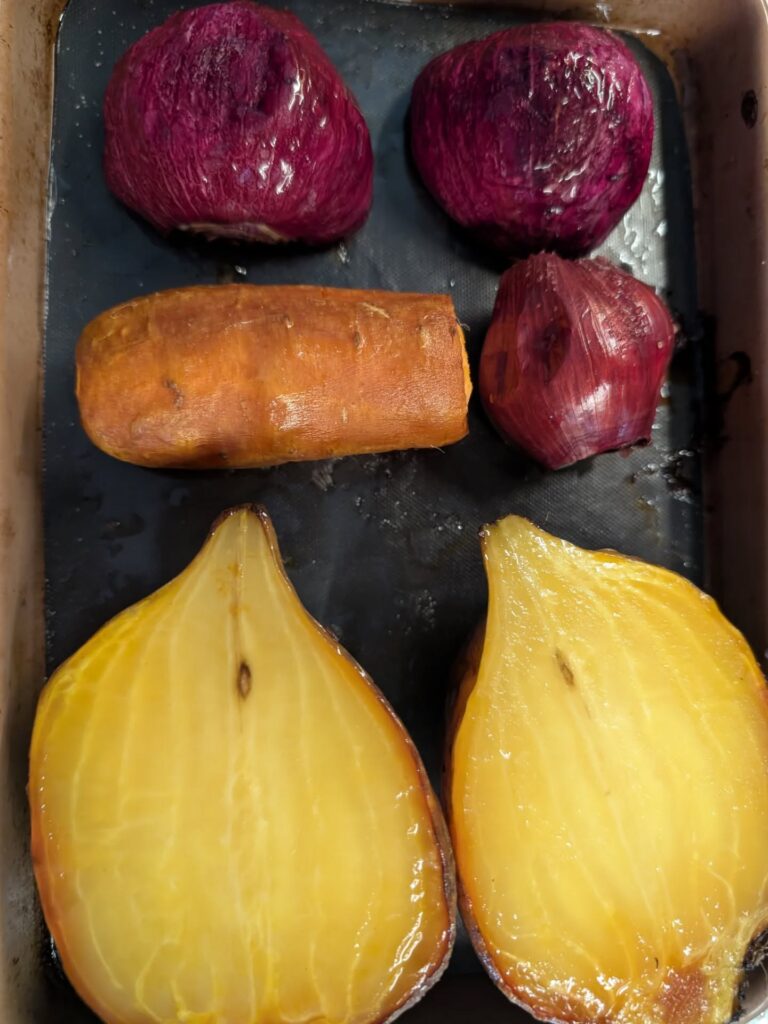 photo of colourful root vegetables on an oven tray